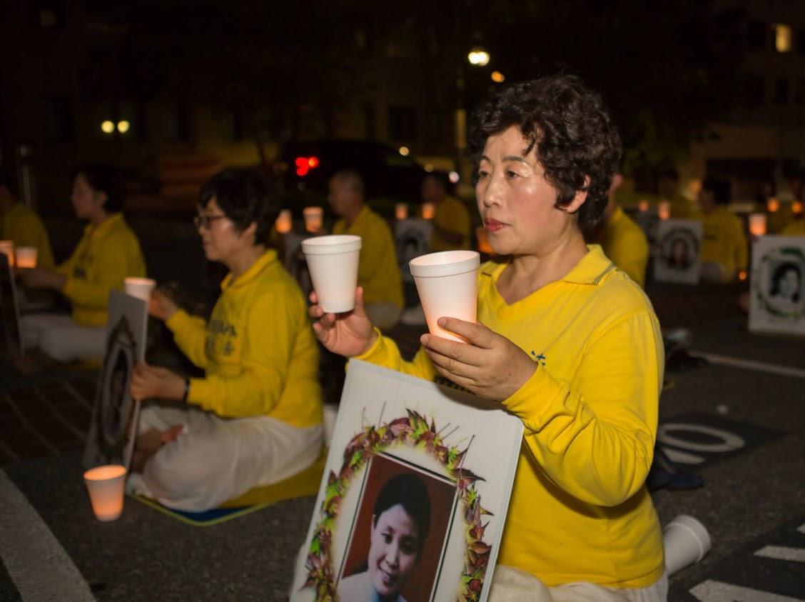 Wang Chunying participates in a candlelight vigil outside the Chinese Embassy in Washington on July 17, 2020. (Lisa Fan/The Epoch Times)