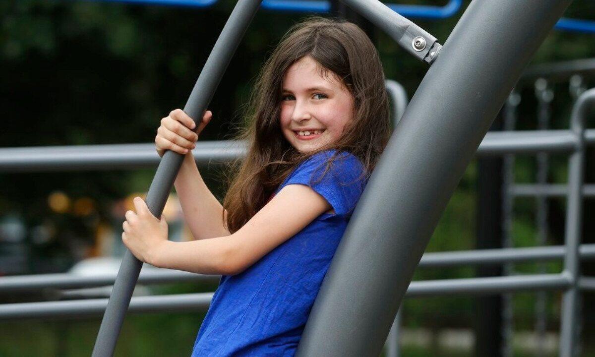Sophia Garabedian, 6, who contracted Eastern Equine Encephalitis in 2019, stands on a playground in Sudbury, Mass., on July 8, 2020. (Steven Senne/AP Photo)