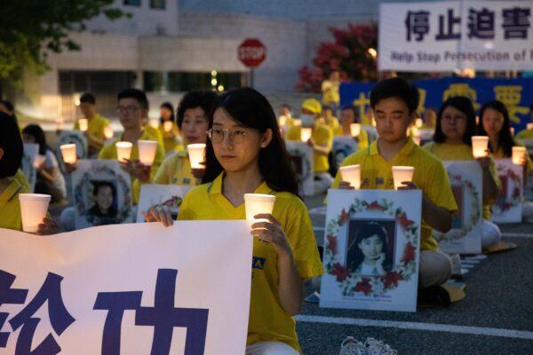 Falun Gong practitioners hold a vigil to commemorate the 21st anniversary of the Chinese regime's persecution of Falun Gong, in Washington, on July 17, 2020. Wang Xin was among the attendees. (Lynn Lin/The Epoch Times)