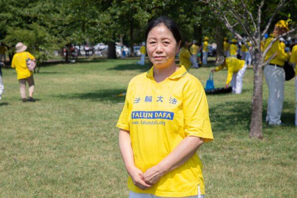 Falun Gong practitioner Li Yingmei attends the group exercises in front of the Washington Monument in Washington, D.C. on July 19, 2020. (Lynn Lin/The Epoch Times)