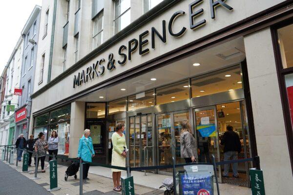 Customers queue to enter a Marks & Spencer shop in York, United Kingdom, on June 15, 2020. (Ian Forsyth/Getty Images)