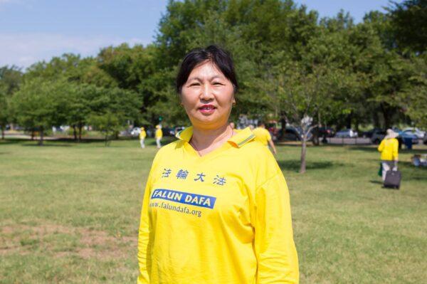 Falun Gong practitioner Yu Jing attends the group exercises in front of the Washington Monument in Washington, D.C. on July 19, 2020. (Lisa Fan/The Epoch Times)