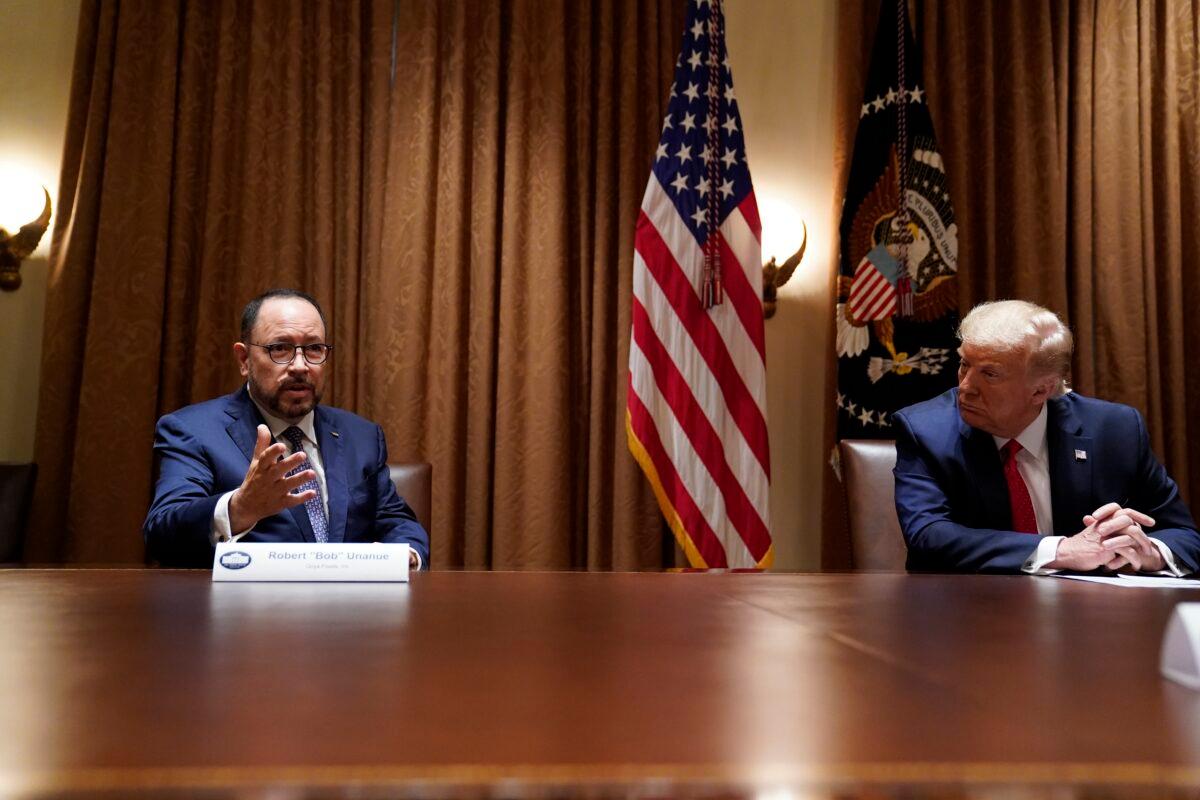 President Donald Trump listens as Robert Unanue of Goya Foods speaks during a roundtable meeting with Hispanic leaders in the Cabinet Room in Washington on July 9, 2020. (Evan Vucci/AP Photo)