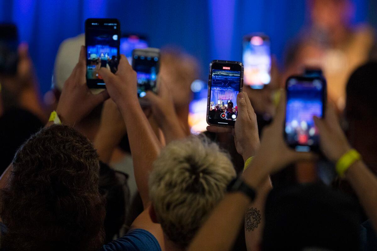 People record on their phones as Kanye West makes his first presidential campaign appearance in North Charleston, S.C., on July 19, 2020. (Lauren Petracca Ipetracca/The Post And Courier via AP)