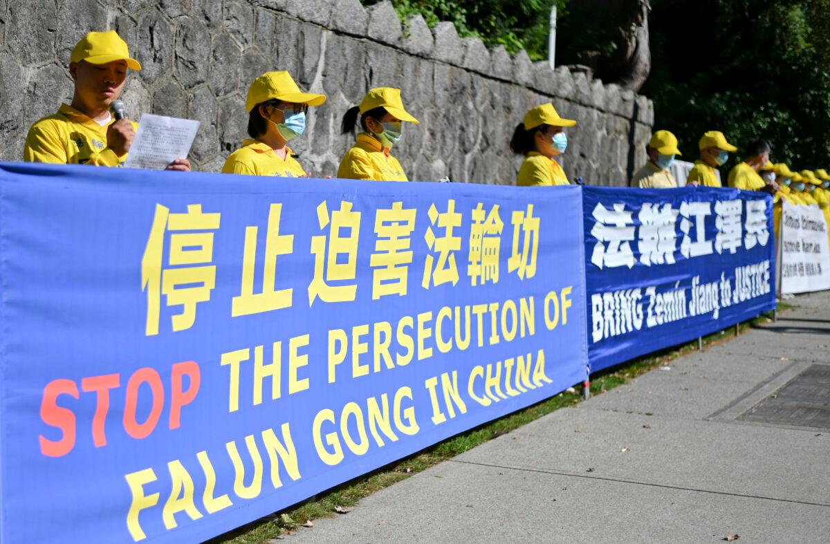 Falun Gong practitioners hold a rally to commemorate the 21st anniversary of the persecution of Falun Gong, in Vancouver, Canada, on July 19, 2020. (Da Yu/The Epoch Times)