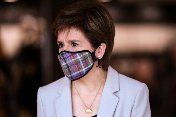 First Minister of Scotland Nicola Sturgeon wears a Tartan mask in Edinburgh, Scotland on June 26, 2020. (Jeff J Mitchell/Pool via Reuters)