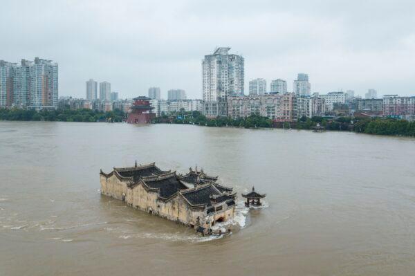 Guanyinge temple, a 700-year old temple built on a rock, is inundated in the swollen Yangtze River in Ezhou, China on July 19, 2020. (STR/AFP via Getty Images)