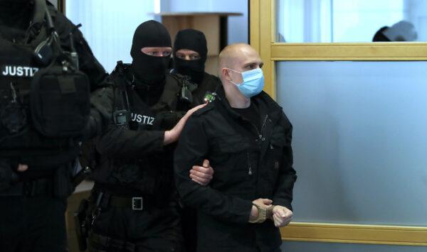 Stephan Balliet, who is accused of shooting two people after an attempt to storm a synagogue in Halle, arrives into the courtroom for the start of his trial, at the district court in Magdeburg, Germany, on July 21, 2020. (Ronny Hartmann/Pool via Reuters)