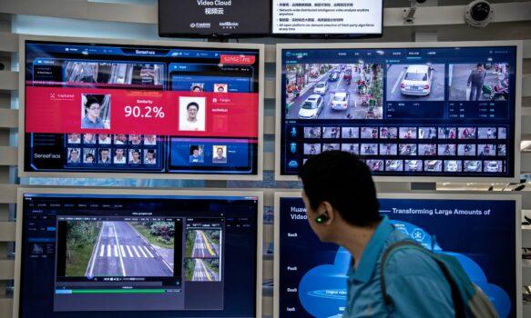 A display for facial recognition and artificial intelligence is seen on monitors at Huawei's Bantian campus in Shenzhen, China, on April 26, 2019. (Kevin Frayer/Getty Images)