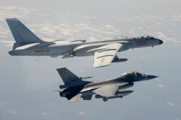 A Taiwanese Air Force F-16 in the foreground flies on the flank of a Chinese People's Liberation Army Air Force H-6 bomber as it passes near Taiwan on Feb. 10, 2020. (Republic of China Ministry of National Defense via AP)