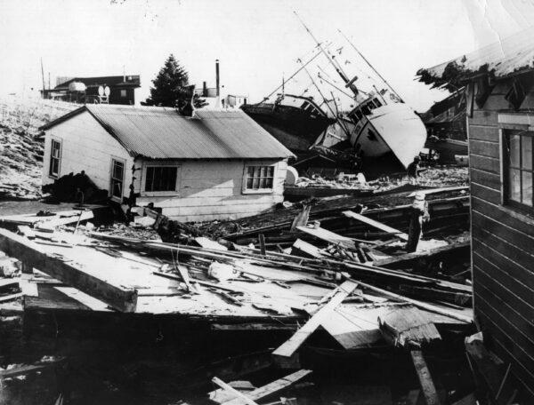 The small fishing village on Kodiak Island, in Alaska, littered with debris from houses and boats after an earthquake and tidal wave struck the island in April 1964. (Central Press/Getty Images)