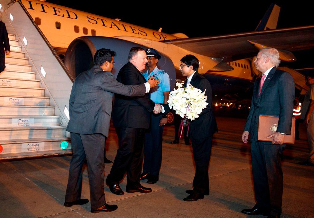 US Secretary of State Mike Pompeo (2nd L) receives flowers from Indian Joint Secretary of the Americas Shri Gourangalal Das (2nd R) as US Ambassador to India Kenneth Juster (R) looks on, during Pompeo's arrival in New Delhi on June 25, 2019. (JACQUELYN MARTIN/AFP via Getty Images)