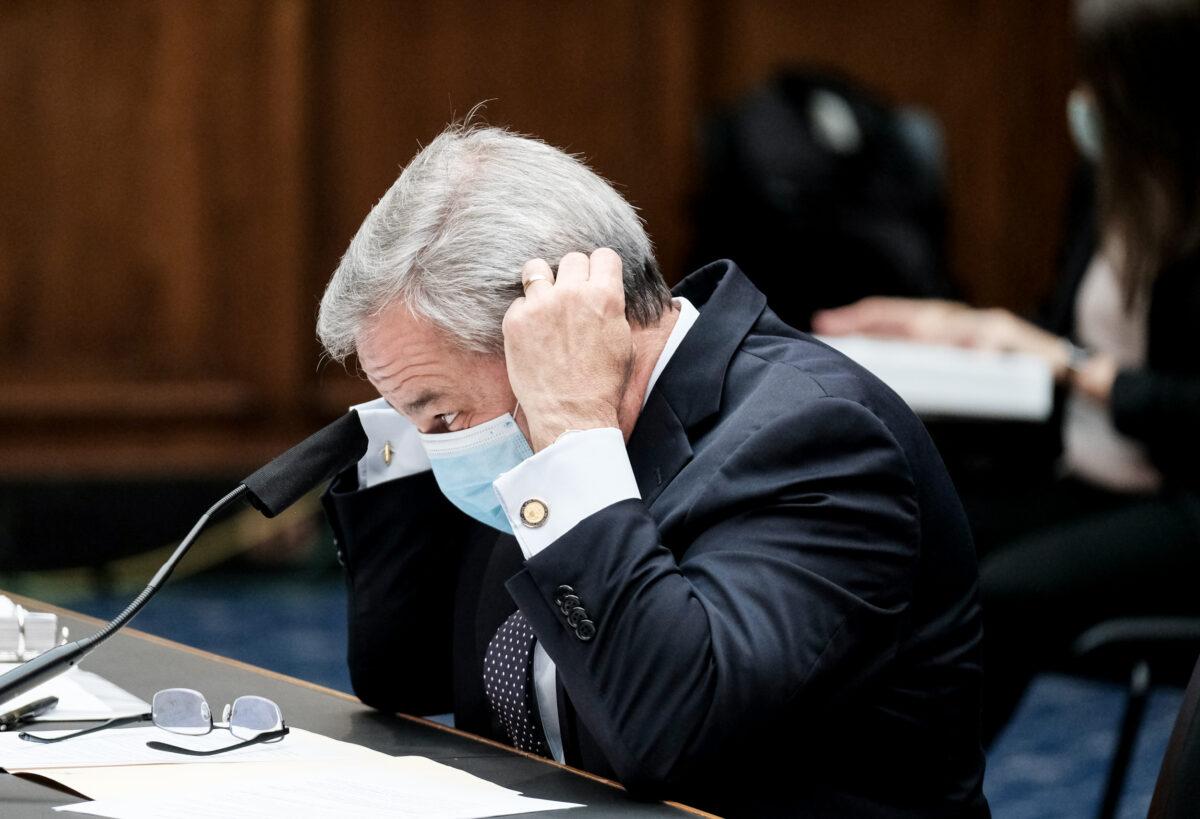 Energy Secretary Dan Brouillette adjusts his mask before testifying at a hearing before the House Committee on Energy and Commerce, Subcommittee on Energy in Washington on July 14, 2020. (Michael A. McCoy/Getty Images)