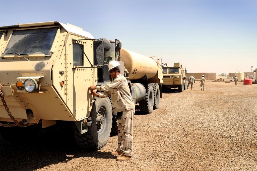 An Iraqi soldier prepares to climb into the cab of a Heavy Expanded Mobility Tactical Truck at Camp Taji, Iraq, Sept. 13, 2011, during a week-long vehicle operator training presented by Alpha Company, 640th Aviation Support Battalion. (Department of Defense)