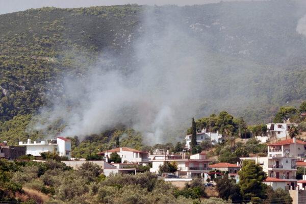 Smoke rises as a wildfire burns near the village of Galataki, Greece, on July 23, 2020.(Vassilis Triandafyllou/Reuters)