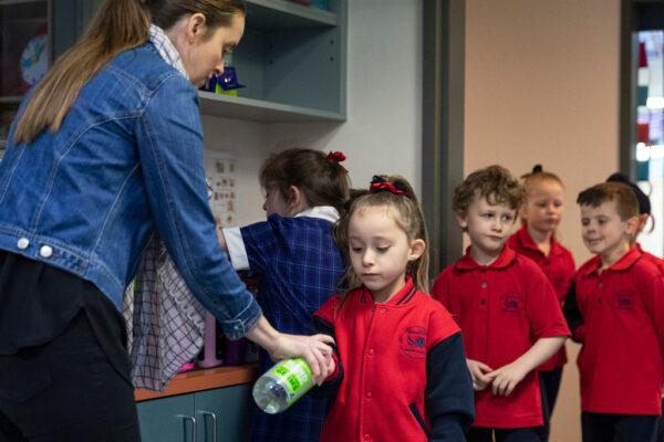 Students sanitize at Lysterfield Primary School on May 26, 2020, in Melbourne, Australia. (Daniel Pockett/Getty Images)