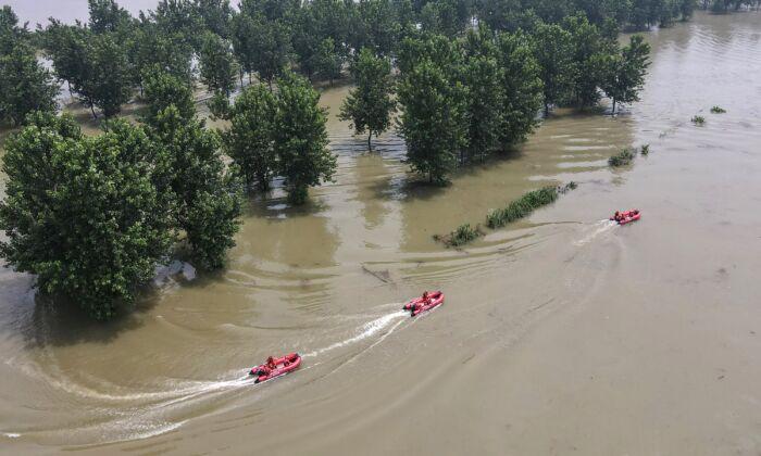 Thousands Trapped as Chinese Authorities Discharge Stormwaters Into Villages, Submerging Them
