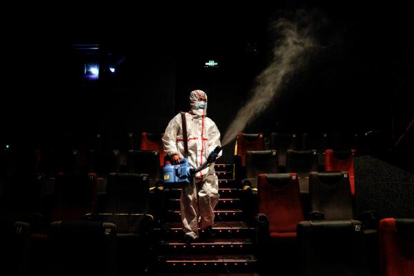 An employee disinfects a cinema in Wuhan, China, on July 20, 2020. (Getty Images)