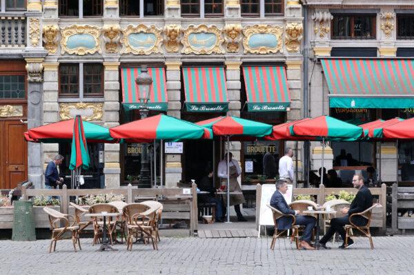 People sit on a terrace as restaurants and bars reopen after weeks of lockdown restrictions amid the coronavirus disease (COVID-19) outbreak, in Brussels, Belgium, on June 8, 2020. (Yves Herman/Reuters)