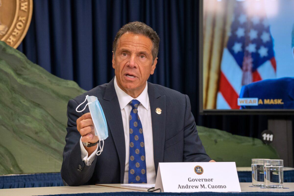 New York Gov. Andrew Cuomo holds a mask during a briefing in New York City, N.Y., on July 6, 2020. (David Dee Delgado/Getty Images)