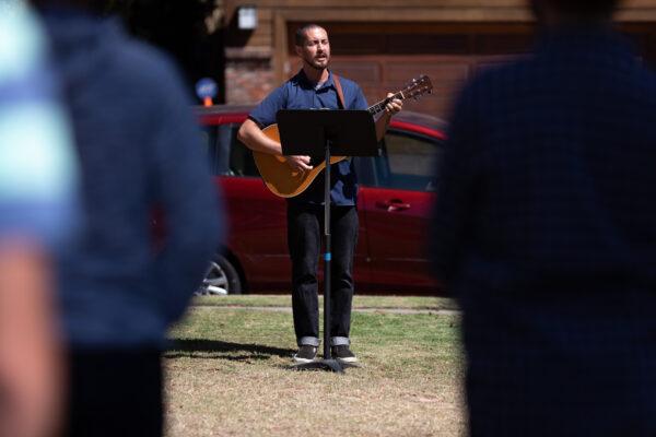 Landon Petrini sings at a Del Rey Church service held outdoors in Los Angeles, Calif., on July 19, 2020. (John Fredricks/The Epoch Times)