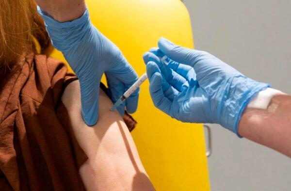 In this handout photo released by the University of Oxford, a volunteer participates in the CCP virus vaccine trial in Oxford, England, on July 7, 2020. (The Canadian Press/AP-University of Oxford via AP)