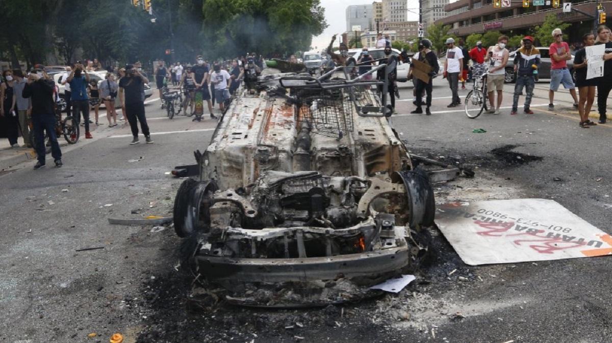 Man Charged for Allegedly Helping Torch Police Car During Riots