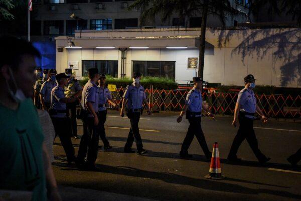 Police walk in front of the entrance of US consulate in Chengdu, southwestern China's Sichuan province, on July 24, 2020. (Noel Celis/AFP via Getty Images)