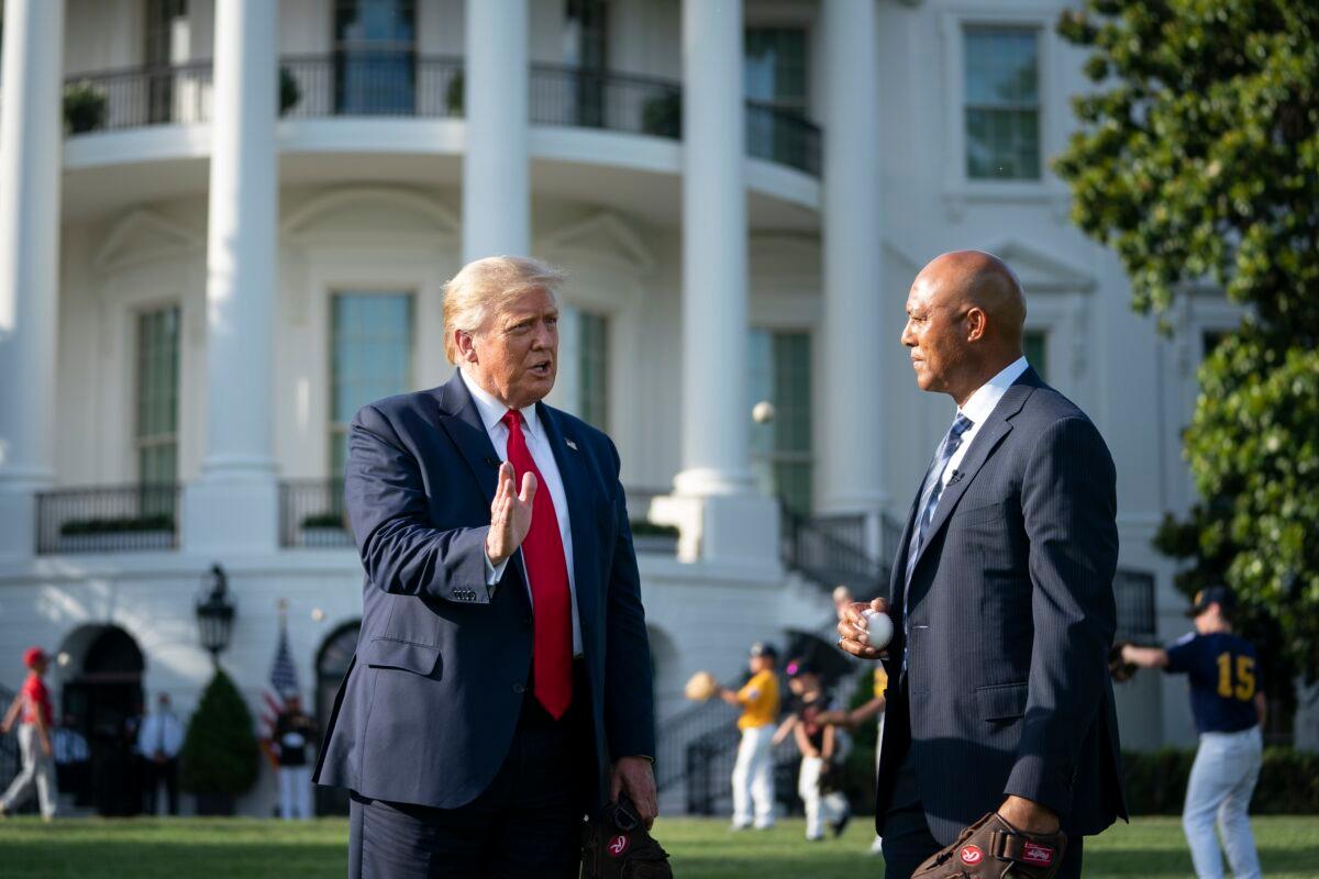 President Donald Trump and former New York Yankees Hall of Fame pitcher Mariano Rivera talk with each other as youth baseball players play catch on the South Lawn of the White House in Washington on July 23, 2020. (Drew Angerer/Getty Images)