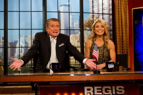 Regis Philbin and Kelly Ripa appear on Regis' farewell episode of "Live! with Regis and Kelly” in New York on Nov. 18, 2011. (Charles Sykes/AP Photo)