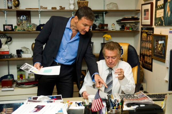 Regis Philbin, right, and producer Michael Gelman go over show prep in Regis's office before a broadcast of "Live! with Regis and Kelly" in New York on Oct. 28, 2011. (Charles Sykes/AP Photo)