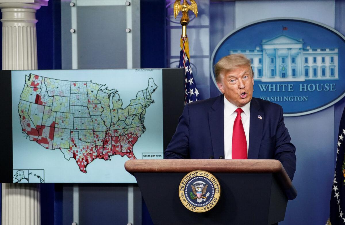 President Donald Trump stands next to a U.S. map of reported CCP virus cases as he speaks about the administration's plan for reopening schools during a COVID-19 news briefing at the White House, on July 23, 2020. (Kevin Lamarque/Reuters)