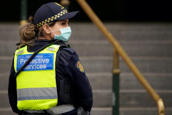 A Protective Services Officer wearing a face mask patrols Flinders Street station in Melbourne after it became the first city in Australia to enforce mask-wearing in public as part of efforts to curb a resurgence of the coronavirus disease (COVID-19), on July 23, 2020. (Sandra Sanders/Reuters)