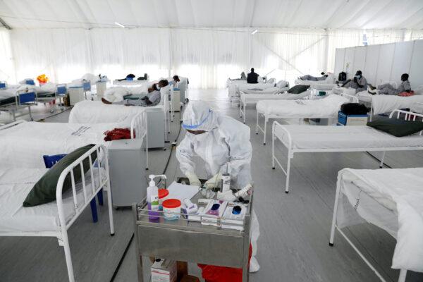 A nurse works inside a field hospital built on a soccer stadium in Machakos, Kenya, on July 23, 2020. (Baz Ratner/Reuters)