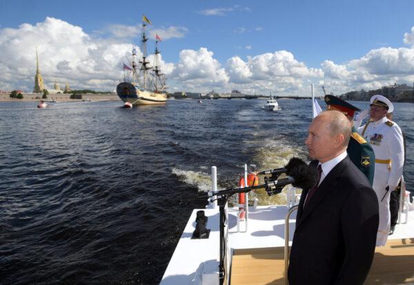 Russia's President Vladimir Putin inspects warships on the Neva river during the Navy Day parade in Saint Petersburg, Russia, on July 26, 2020. (Sputnik/Alexei Druzhinin/Kremlin via Renters)