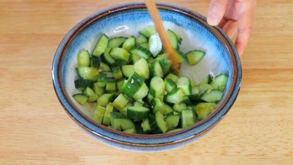 Mix the cucumber pieces with the garlic oil and other dressing ingredients. (photo by CiCi Li)