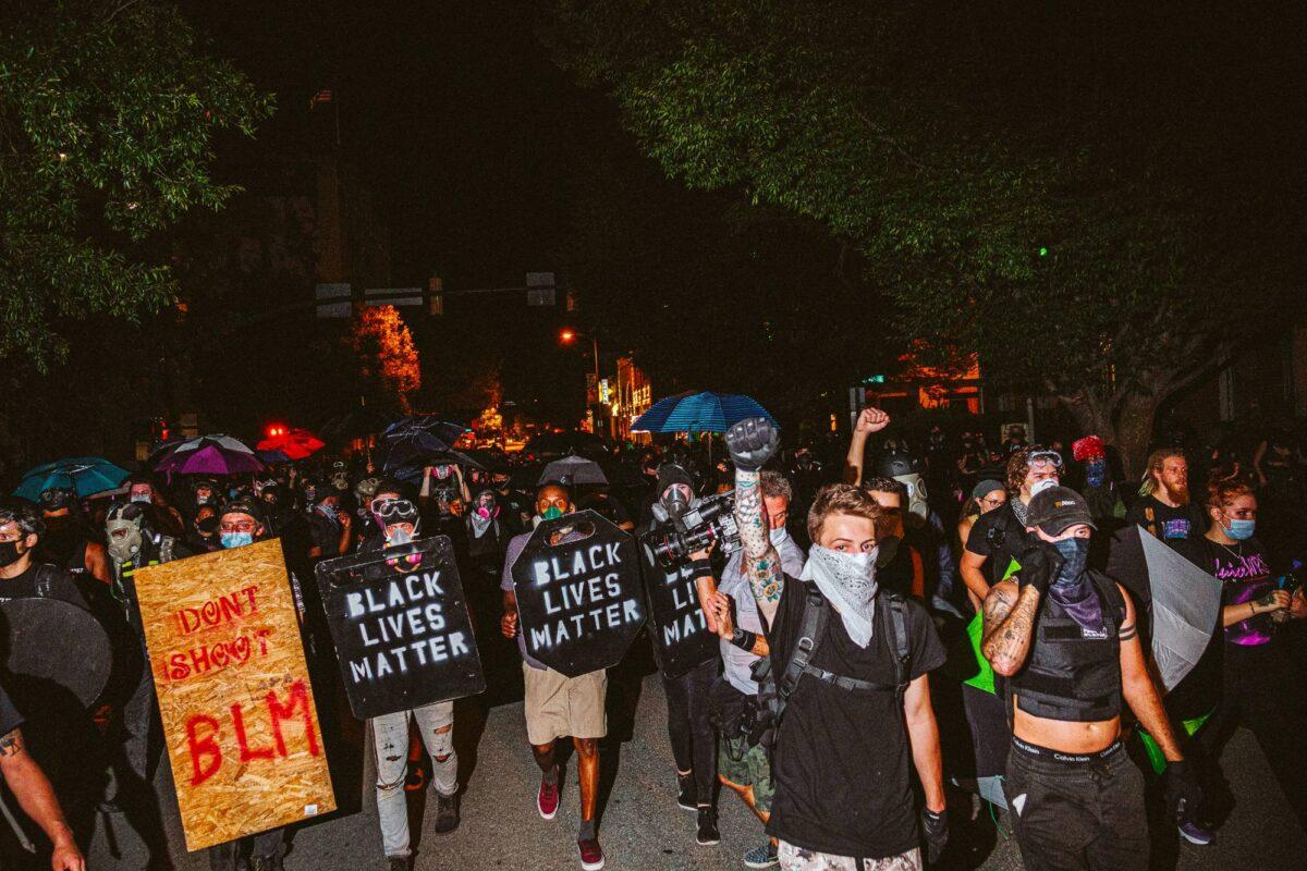 People carrying homemade Black Lives Matter shields march in front of protesters in Richmond, Virginia, on July 25, 2020. (Eze Amos/Getty Images)