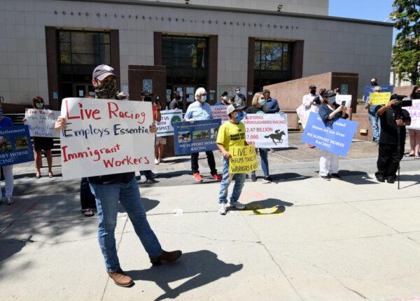 Horse racing industry workers call to re-open Santa Anita Park in front of the offices of the Board of Supervisors of Los Angeles County on April 28, 2020. (Harry How/Getty Images)