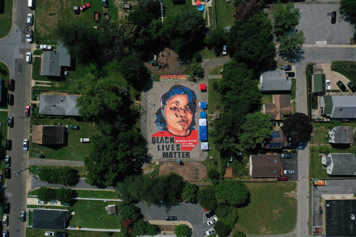 In an aerial view from a drone, a large-scale ground mural depicting Breonna Taylor with the text 'Black Lives Matter' is being painted at Chambers Park in Annapolis, Md., on July 5, 2020. (Patrick Smith/Getty Images)