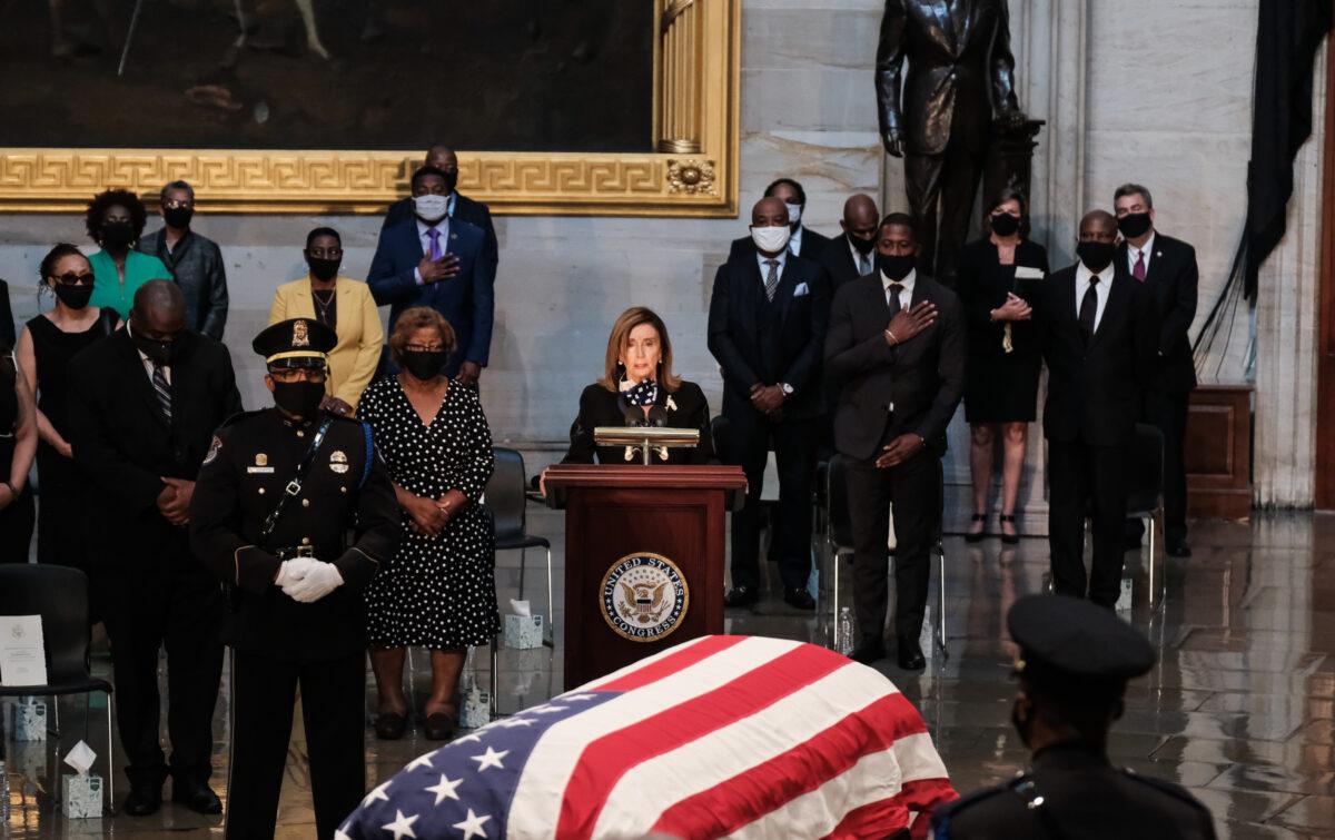 House Speaker Nancy Pelosi (D-Calif.) speaks as the casket of late Rep. John Lewis (D-Ga.) lies in state in the Rotunda of the U.S. Capitol in Washington on July 27, 2020. (Michael A. McCoy/Getty Images)