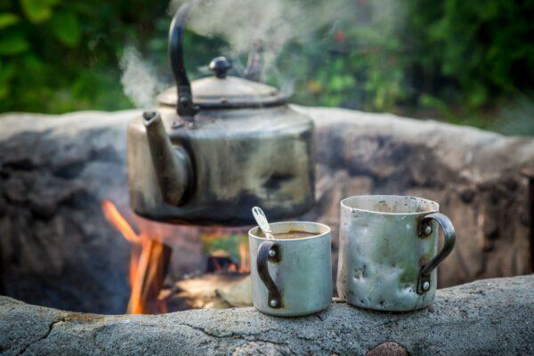 Morning joe around the campfire. (Shaiith/Shutterstock)