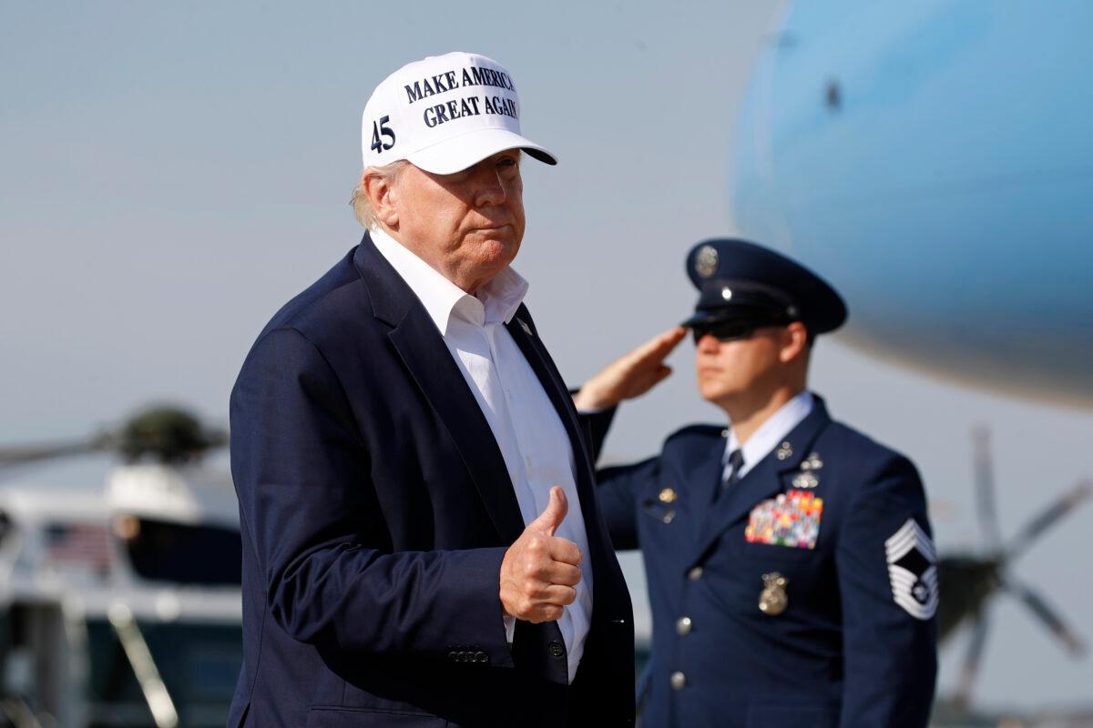 President Donald Trump gestures as he steps off Air Force One at Andrews Air Force Base, Md., July 26, 2020. Trump was returning to Washington after spending the weekend at his golf club in Bedminster, N.J. (Patrick Semansky/AP Photo)
