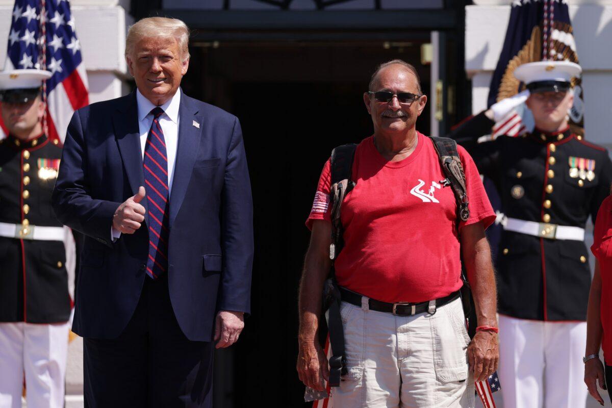 President Donald Trump greets the “Walking Marine” Terry Sharpe at the White House in Washington on July 27, 2020. (Alex Wong/Getty Images)