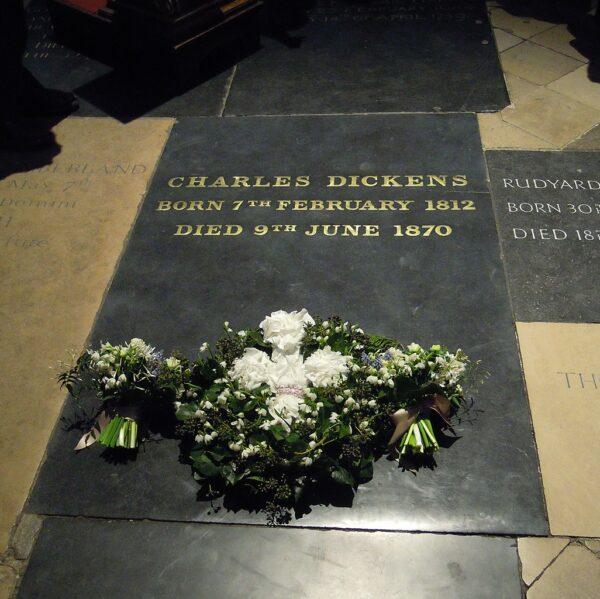 The grave of Charles Dickens in Westminster Abbey. While Dickens had a private funeral, journalists reimagined it as a grand affair. (CC0)