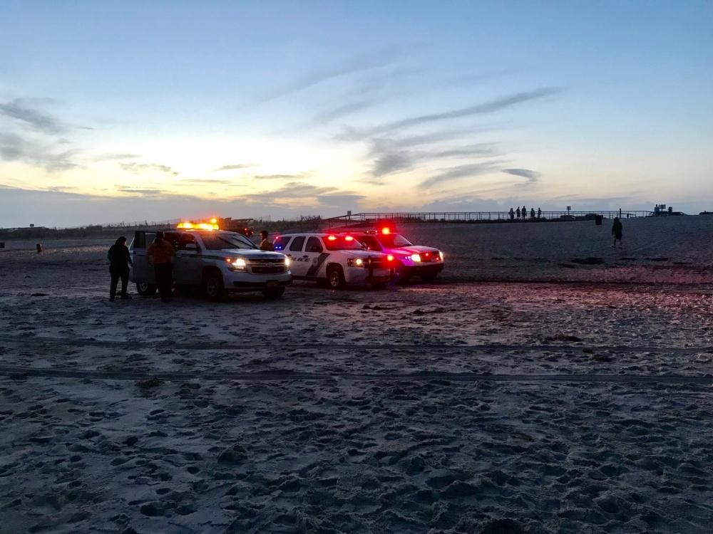 First responders arrive after off-duty Coast Guard Victoria Vanderhaden rescued two distressed swimmers at Fire Island, New York, on July 24, 2018 (<a href="https://www.dvidshub.net/image/4592001/off-duty-coast-guard-member-rescues-2-distressed-swimmers-off-fire-island">U.S. Coast Guard</a>)
