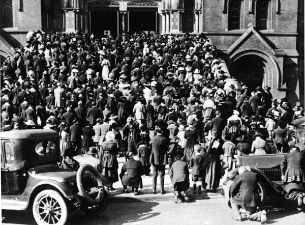 The congregation praying on the steps of the Cathedral of Saint Mary of the Assumption, where they gathered to hear Mass and pray during the influenza epidemic, in San Francisco, Calif., circa 1918. (Archive Photos/Getty Images)