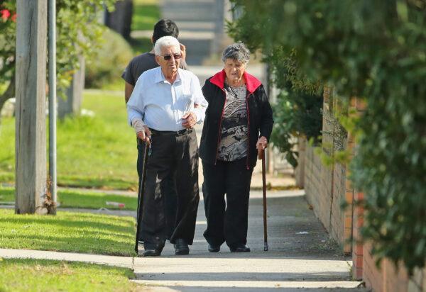 An elderly couple walk down the street on May 13, 2014 in Melbourne, Australia. (Photo by Scott Barbour/Getty Images)