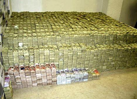 A stack of $205 million in cash sits in a room of a Chinese chemical distributor living in Mexico. (DOJ)