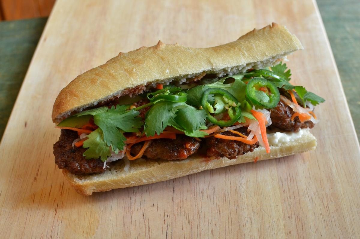 Tip's banh mi with Thai-style pork patties. (Kevin Revolinski)