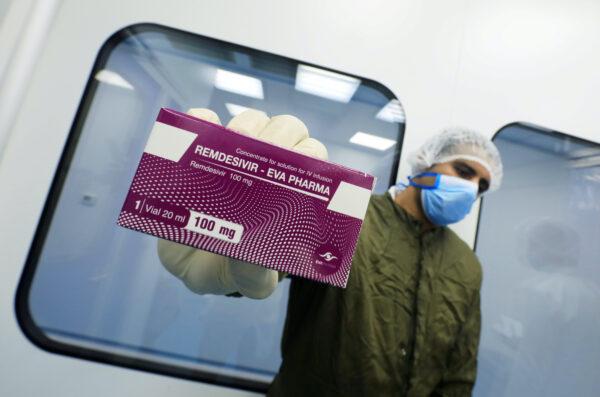 A lab technicians holds the drug "Remdesivir" at Eva Pharma Facility in Cairo, Egypt, on June 25, 2020. (Amr Abdallah Dalsh/Reuters)